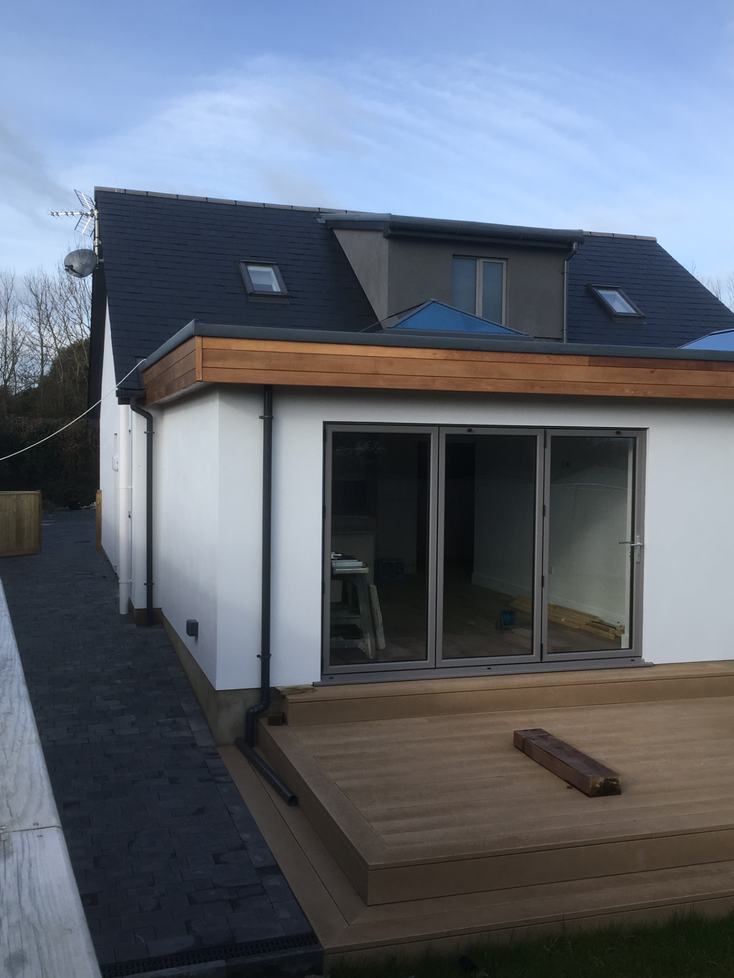 A finished Timber Craft extension in Guernsey with bi-fold doors and composite decking