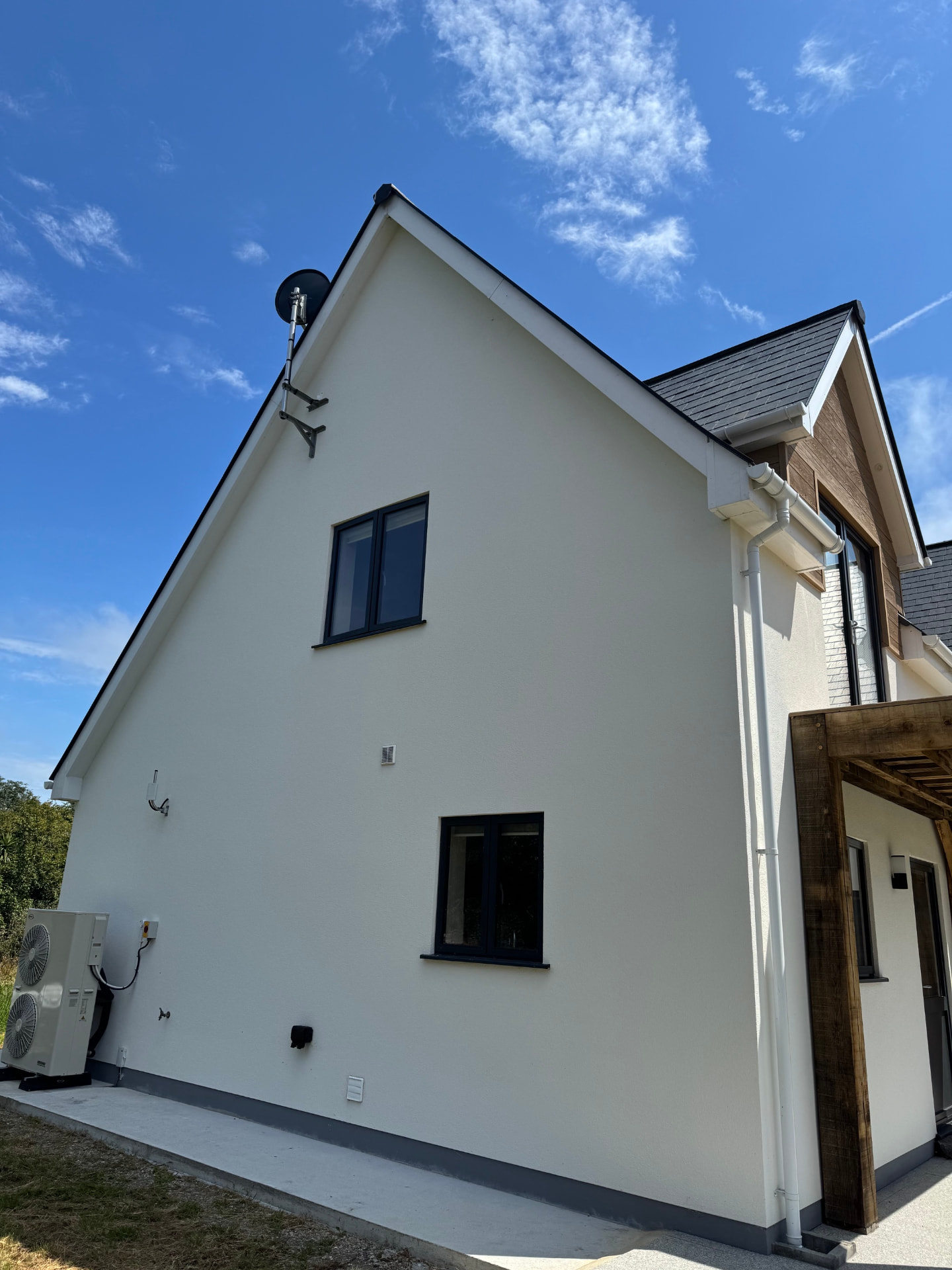 Rendered gable elevation of the newbuild with new windows and air source unit
