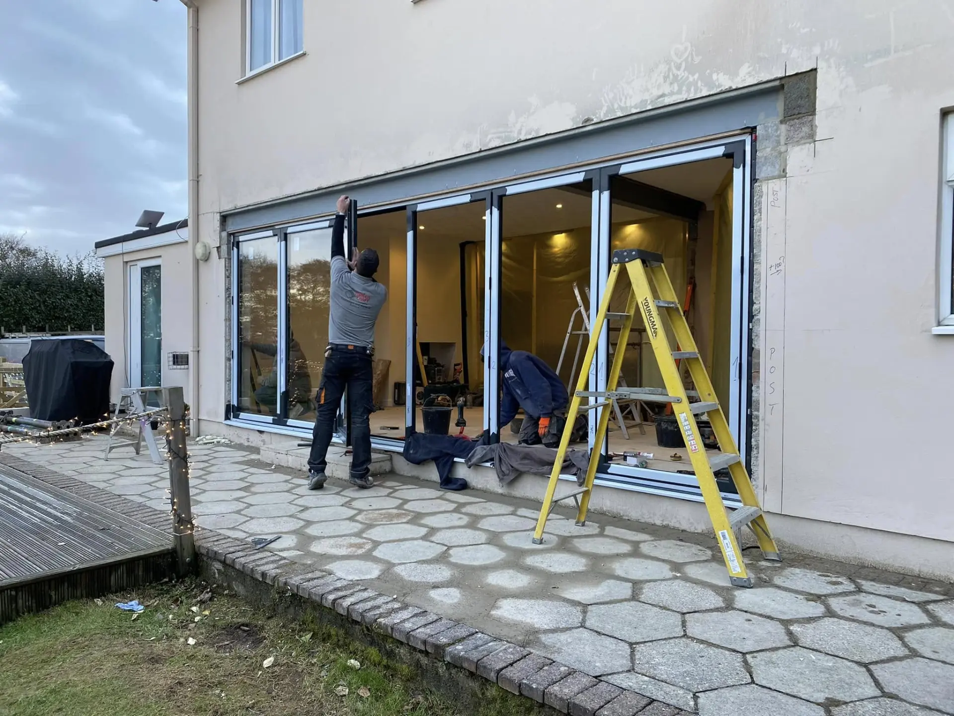 The Timber Craft Developments team at work installing sliding doors
