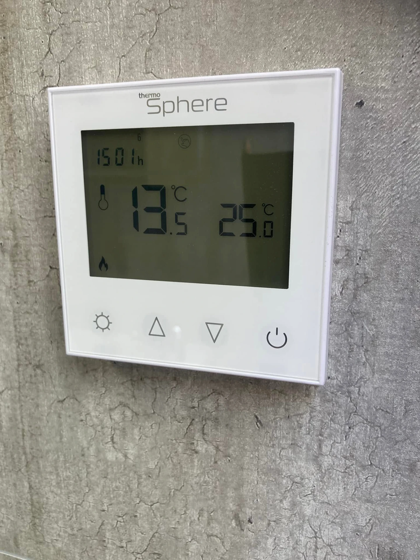 Digital underfloor heating controller inside a shower pod