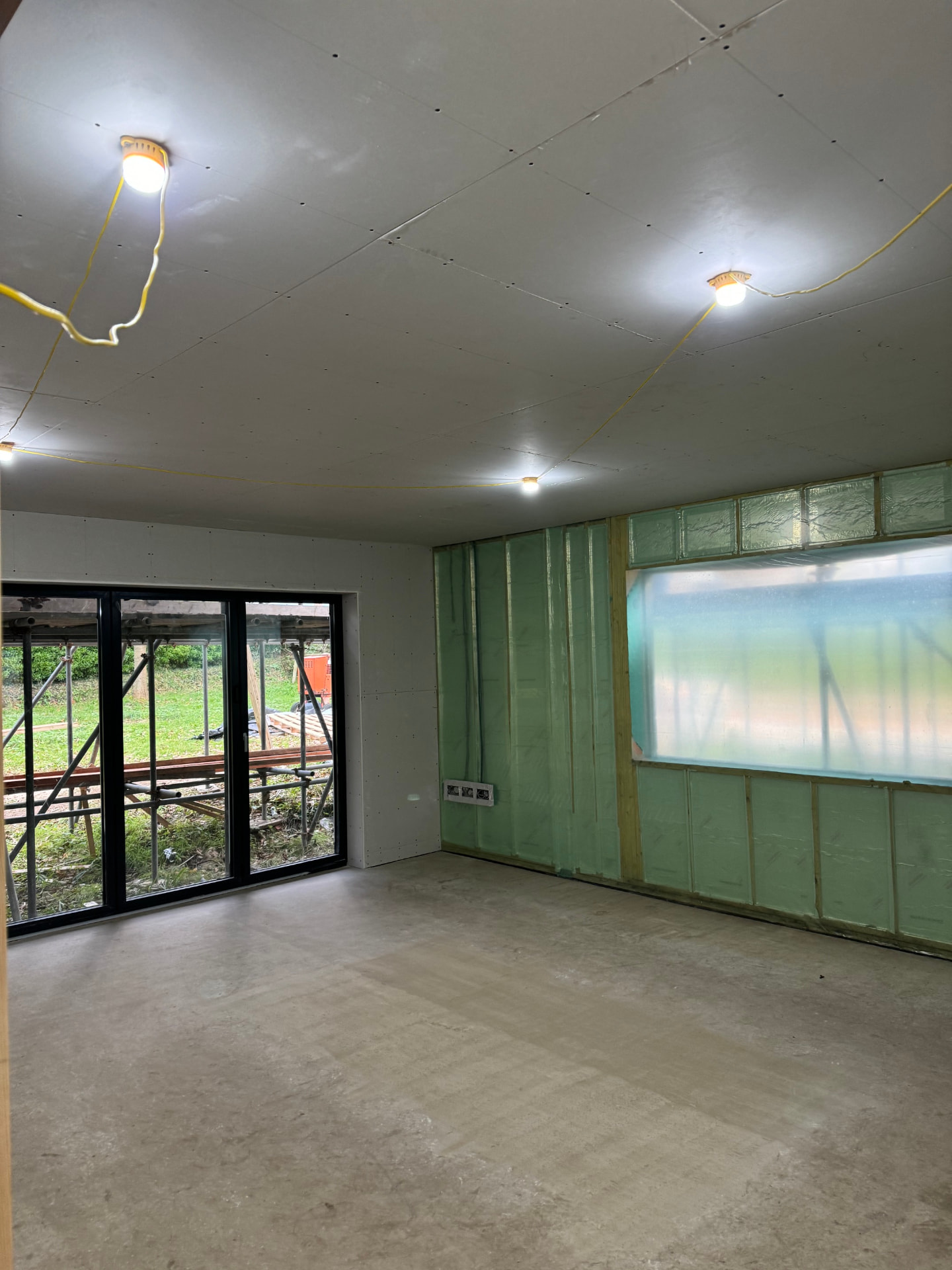 Boarded interior with new sliding doors ready for plastering