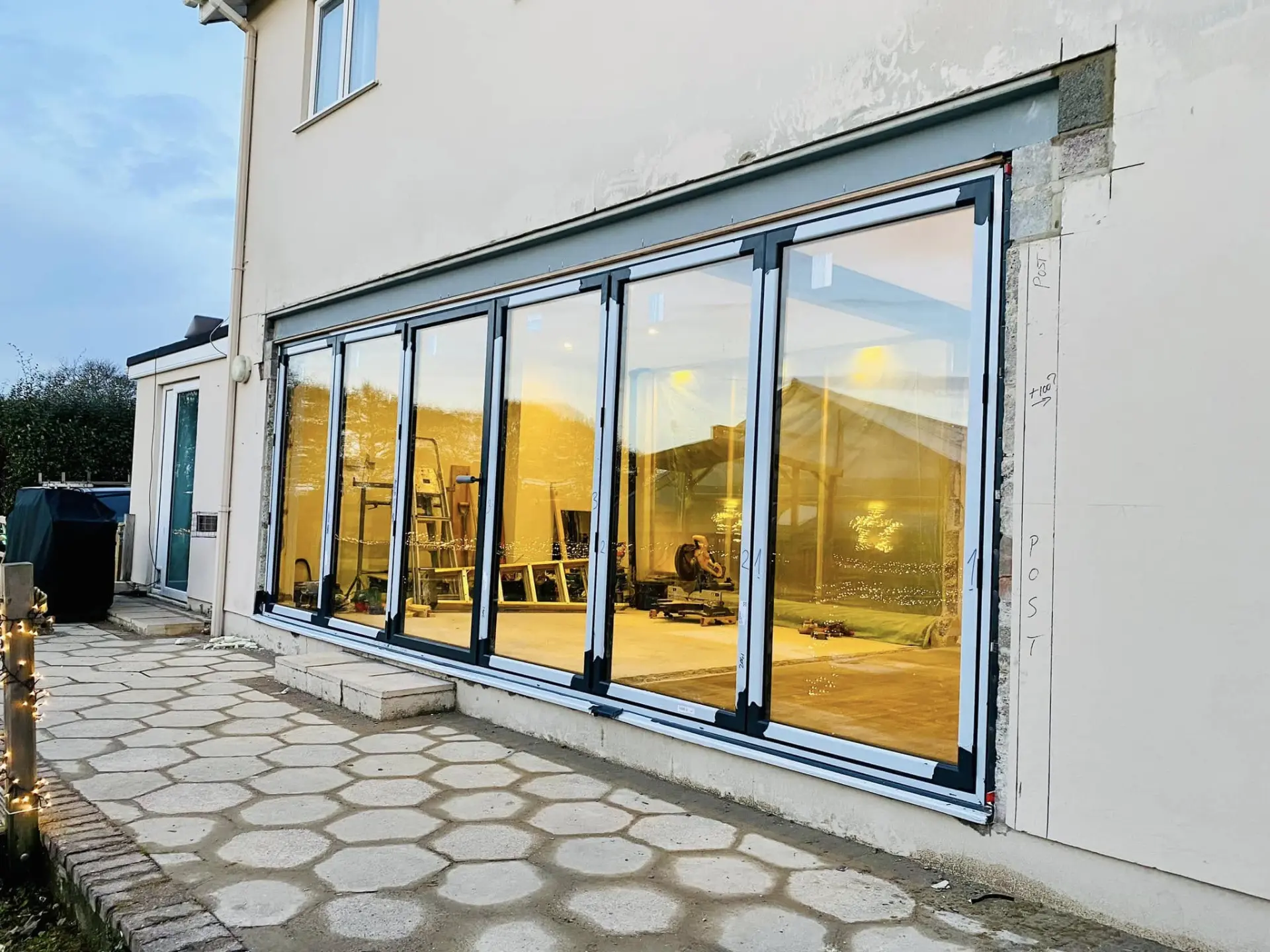 Finished floor-to-ceiling sliding doors on a Timber Craft extension