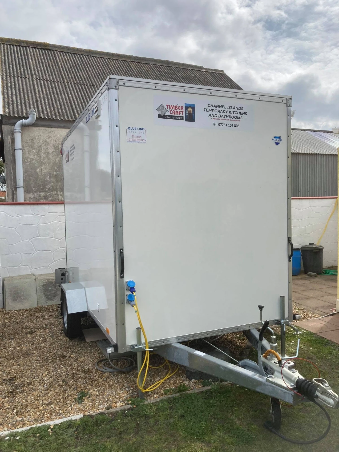A Timber Craft Developments branded temporary kitchen and bathroom pod trailer